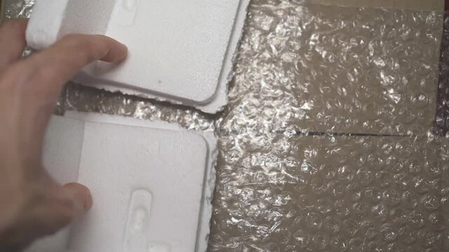 Cardboard box, bubble wrap and eps foam are used for packing fragile items.