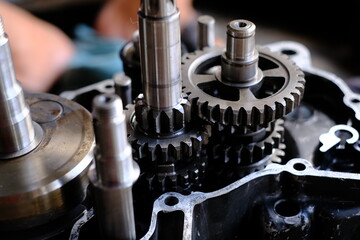 Assemble the motorcycle engine gear by a maintenance technician and check it.