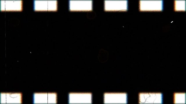 A strip of old spoiled film moves from left to right.