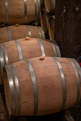 Keeping for years of dry red wine in new oak barrels in caves in Burgundy, made from pinot noir grape