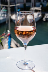 Summer on French Riviera Cote d'Azur, drinking cold rose wine from Cotes de Provence on outdoor terrase in Port Grimaud, Var, France