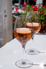 Summer on French Riviera Cote d'Azur, drinking cold rose wine from Cotes de Provence on outdoor terrase in Port Grimaud, Var, France