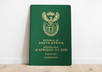 South African passport on a white wall