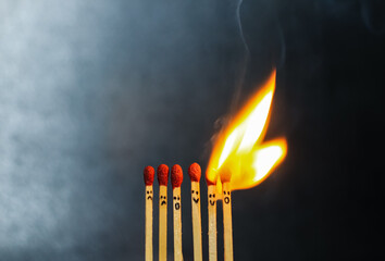 Group of a red match burning isolated with the background. Row burning matchstick in the chain...