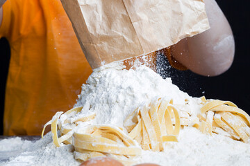 a child with a bag of flour