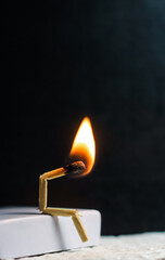 Concept of weakness, sadness, and loneliness. Image of a man-made matchstick. Burning matchstick...