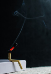 Concept of weakness, sadness, and loneliness. Image of a man-made matchstick. Burning matchstick...