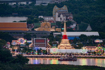 Beautiful night festival scene of Wat Phra Samut Chedi temple with lighting on the Chao Phraya river during sunset in Samut Prakan, Province, Thailand.