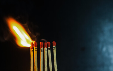 Group of a red match burning isolated with the background. Row burning matchstick in the chain...