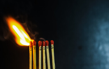 Group of a red match burning isolated with the background. Row burning matchstick in the chain reaction. Matchstick art photography.