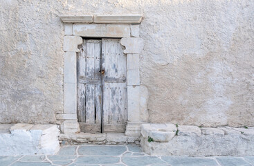Folegandros island, Old church entrance door at Chora town. Greece, Cyclades.