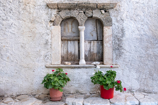 Folegandros island, Windows of an old church at Chora town square. Greece, Cyclades.