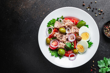 tuna salad vegetables tomato, onion, herbs, olives other canned tuna fish seafood on the table, healthy meal copy space food background top view keto or paleo diet veggie vegetarian food pescetarian 
