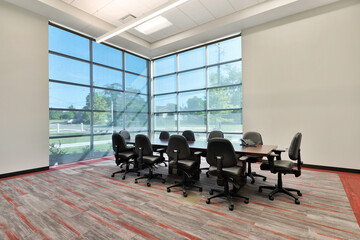 Modern office conference room interior with unique striped carpet and large windows