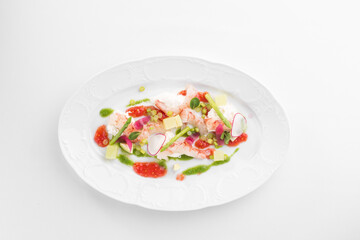 Avocado and Shrimps Salad on white plate isolated on white background