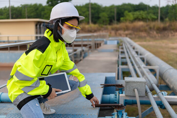 Environmental engineers work at wastewater treatment plants,Water supply engineering working at...