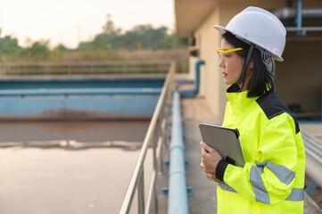 Obraz premium Environmental engineers work at wastewater treatment plants,Water supply engineering working at Water recycling plant for reuse