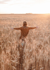 portrait of girl in a field with wheat