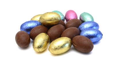Chocolate easter eggs in colorful foil on white background