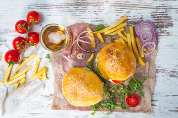 Homemade Beef Burger with Cheese and Chips on wooden background