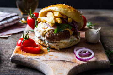Real American bacon burger with fries and beer