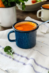 Carrot soup on a table in mugs. Homemade healty food