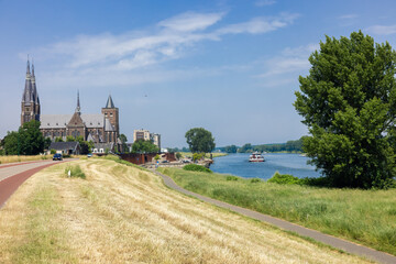 Dutch village Cuijk along river Meuse, view at Martinus church