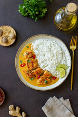 Chicken tikka masala curry with rice, herbs and peppers. Indian food. National cuisine.