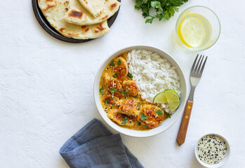 Chicken tikka masala curry with rice, herbs and peppers. Indian food. National cuisine.