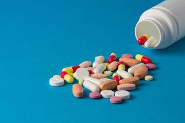 pills, vitamins, capsules on a blue background