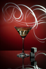 Cocktail glass on red gradient background