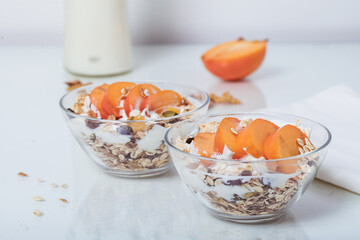 Homemade vegan granola cereal with soy yogurt, walnuts, fuji apple and almond milk.