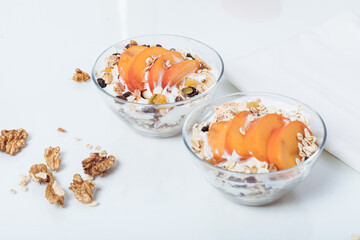Homemade vegan granola cereal with soy yogurt, walnuts, fuji apple and almond milk.