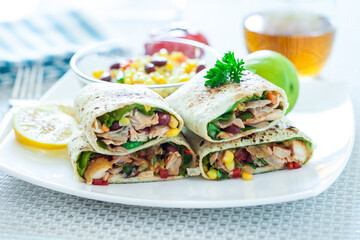 Traditional Mexican Food -  Burrito, on white wooden retro table