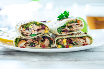 Traditional Mexican Food -  Burrito, on white wooden retro table