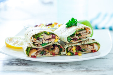 Traditional Mexican Food -  Burrito, on white wooden retro table