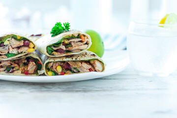 Traditional Mexican Food -  Burrito, on white wooden retro table