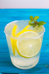 Bottle of fresh drink with lemon and mint flavour, juice