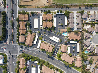 Fototapeta na wymiar Aerial top view of San Marcos neighborhood with houses and street during sunny day, California, USA.