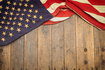 Antique American flag drapped over an old workbench - obrazy, fototapety, plakaty