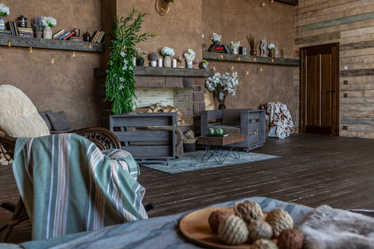 dark cozy interior of big country wooden house, wooden furniture and animal furs. huge panoramic window and very high ceiling.