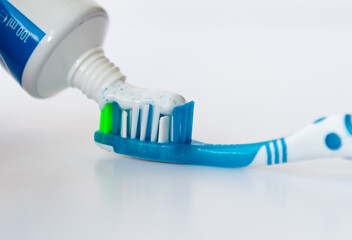 Tooth brush and paste isolated in white.