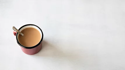 Fototapeten milk coffee on a rustig mug on white background © Jorgedeandresphoto