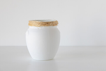 White jars on white background minimalism concept