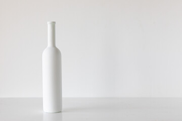 white bottle on white background minimalism concept