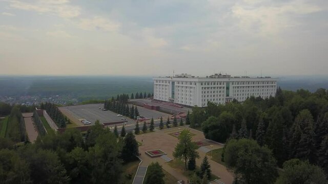 The Republic House with forest and city building. Ufa, Bashkortostan