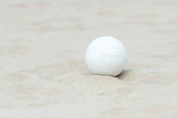 Naklejka premium Beach volleyball ball on the sand beach. Team sport concept