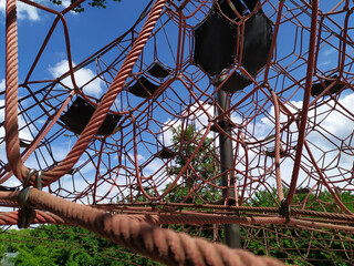 High rope climbing frame on a playground in summer to encourage children to climb and train...