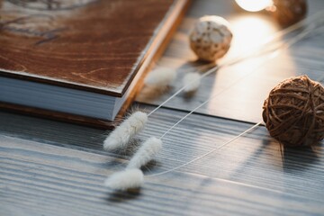 Luxury wooden photo book on natural background. Family memories photobook. Save your summer vacation memories. Photo album wedding photoalbum with wooden cover.