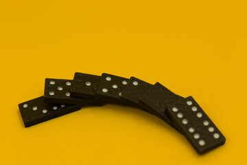 dominoes fell on yellow background